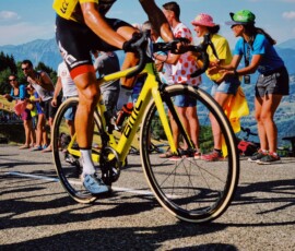 man riding yellow bicycle